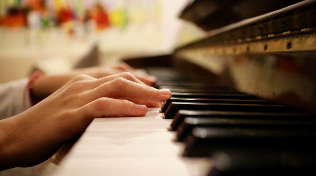 Child's hands on piano keys