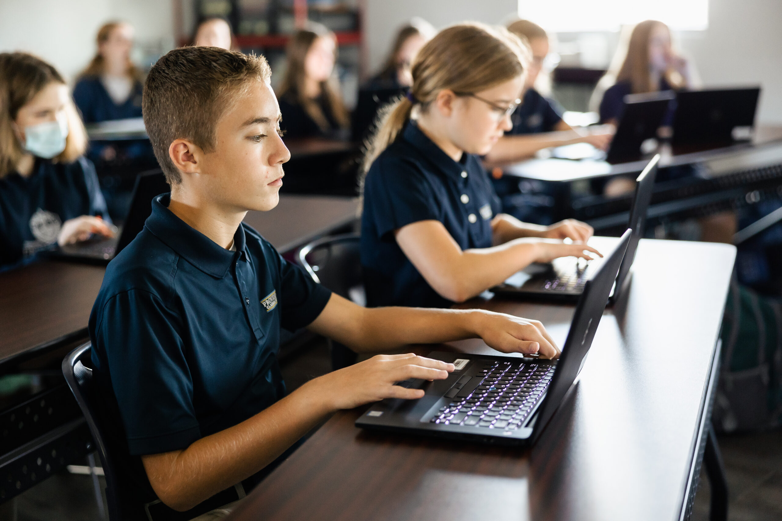 Middle School students using computers at Providence Classical School